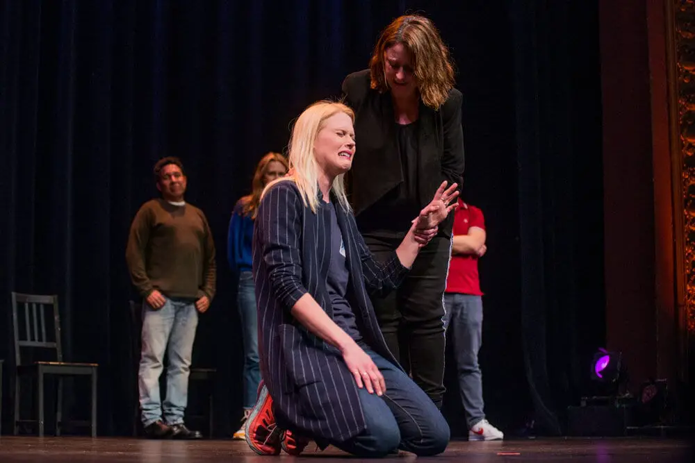 Janet Varney performing on stage