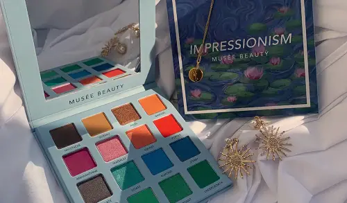 The Fandomentals Lifestyle Gift Guide 2020 2 colorful makeup palette and earrings on a white backdrop