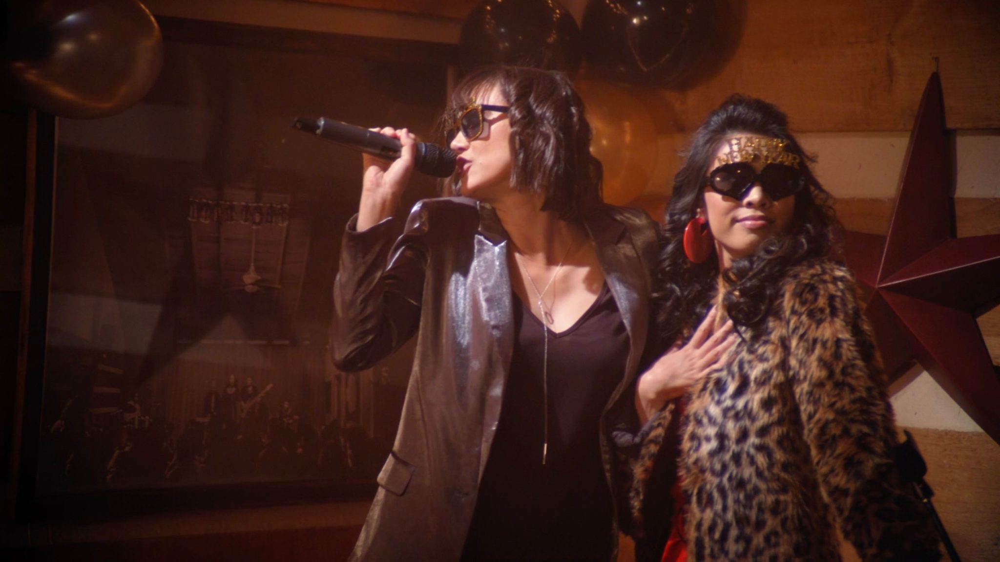 I Hate New Year's Christin Baker and Ashley Argota On Representative Art 6 Two asian women singing at karaoke