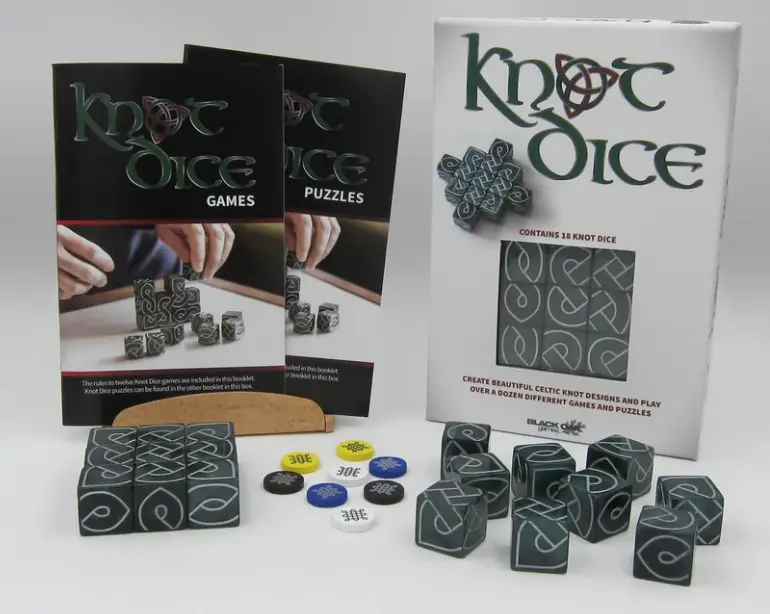 knot dice packaging with 18 dice, 8 wooden tokens, and games and puzzles booklets