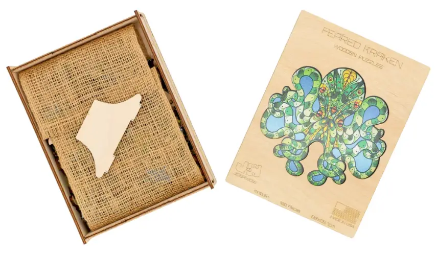 JigsaWow Puzzles Cunningly Difficult Entertainment 3 open box showing piece that holds cover up