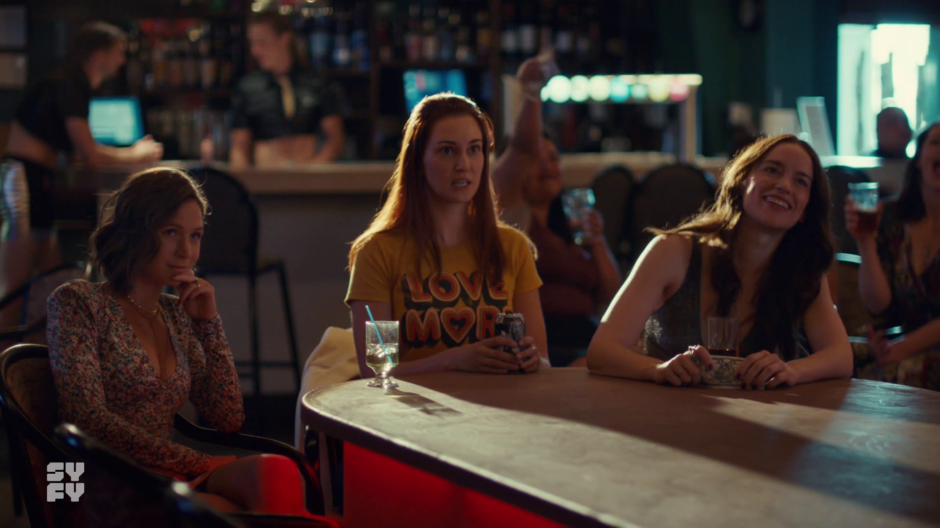 Waverly, Nicole and Wynonna look on at stripper. 