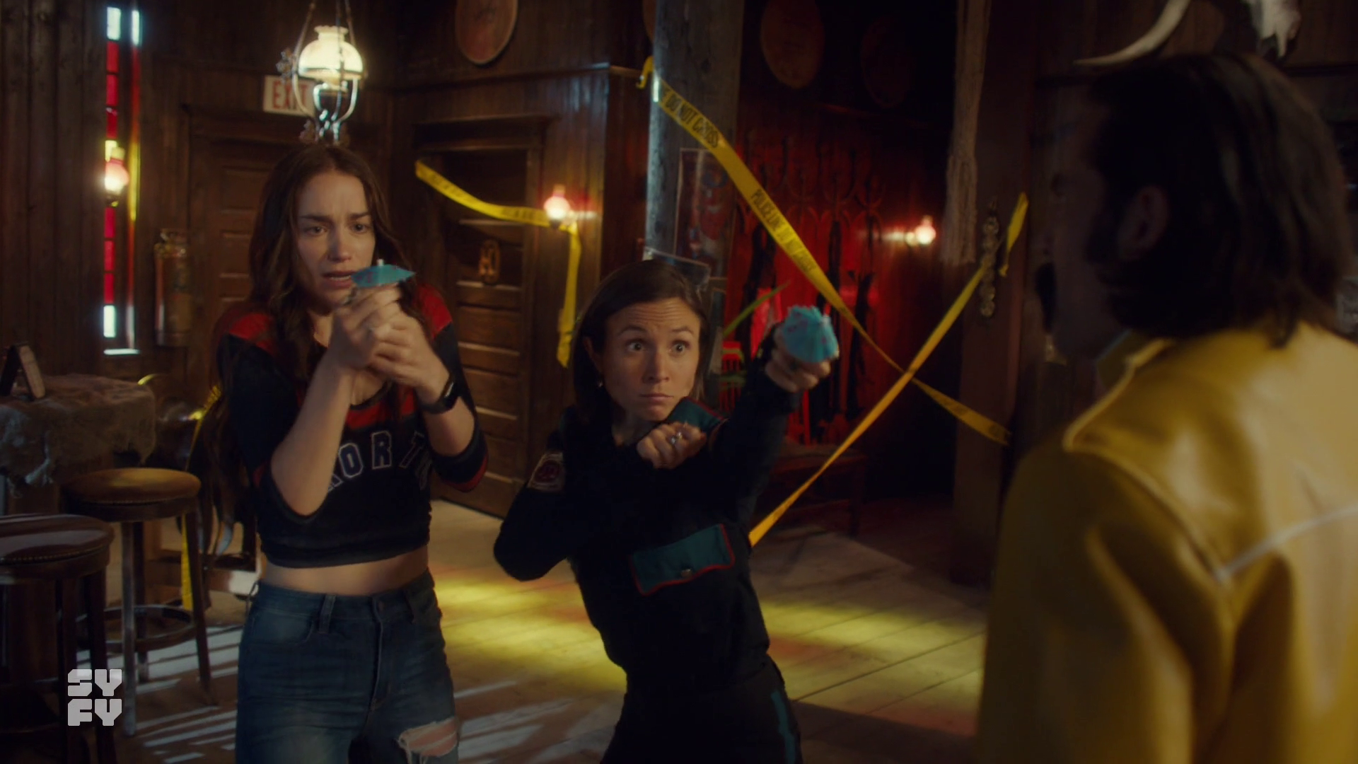 Wynonna and Waverly defending themselves with little paper umbrellas