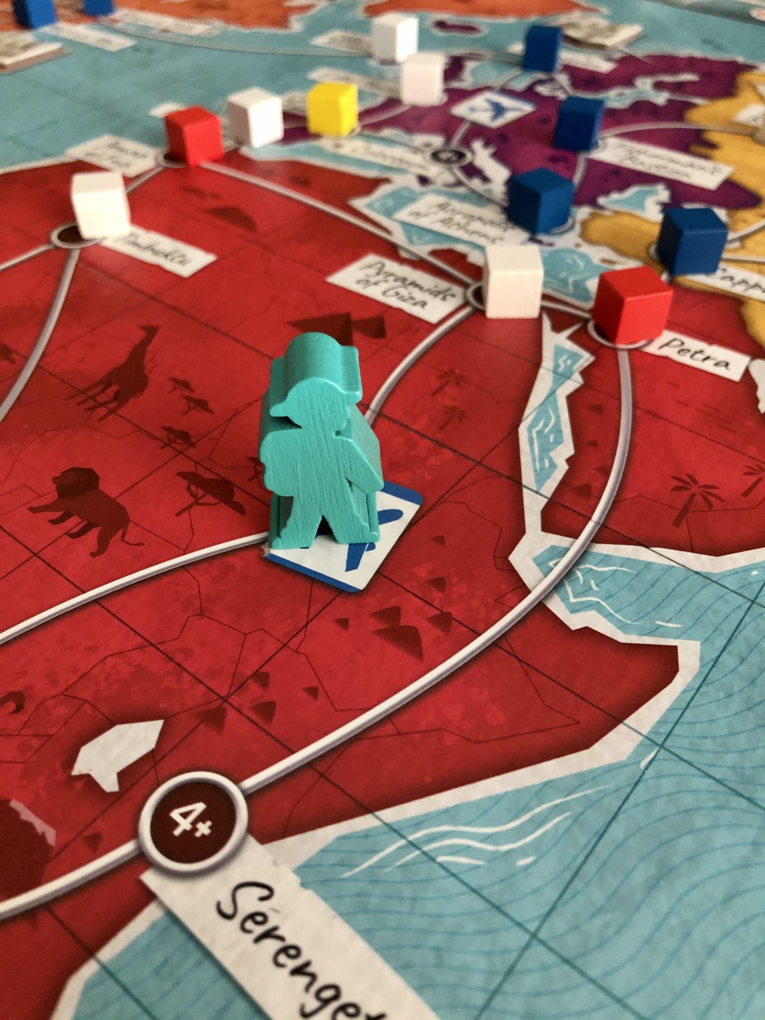 Trekking The World meeple on the board