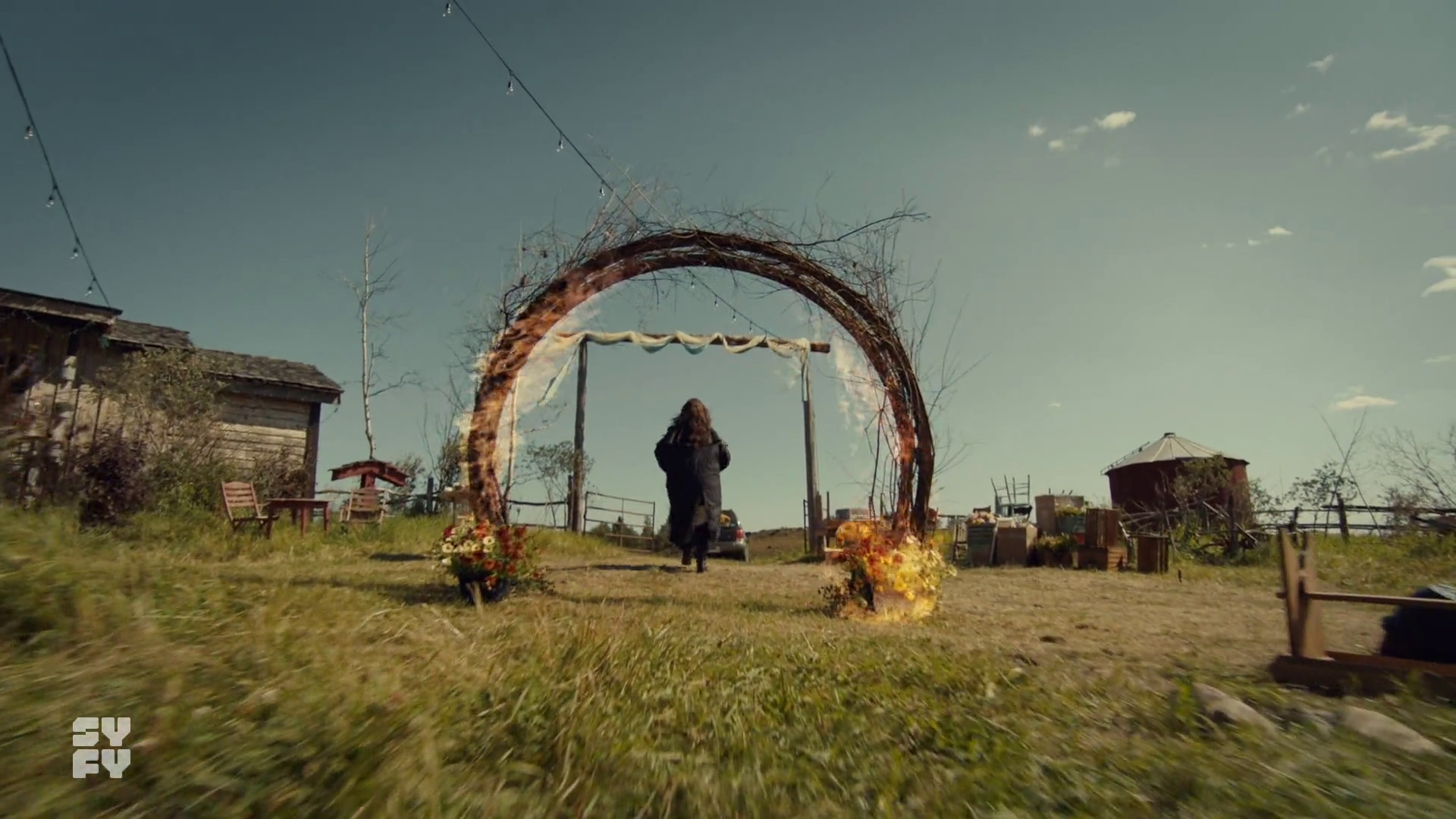 Purgatory is For Lovers, A Fond Farewell to Wynonna Earp 2 A burning arbor while Wynonna walks away.