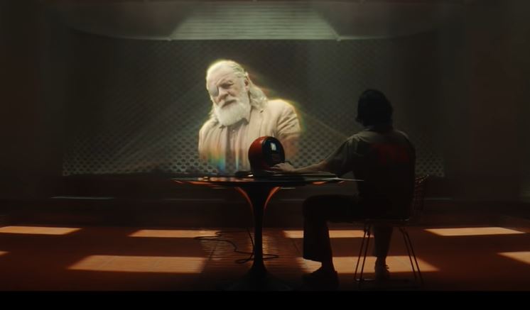 Loki's Debut proves Exposition Doesn't Have to be Boring 2 Loki Watching Odin on Screen