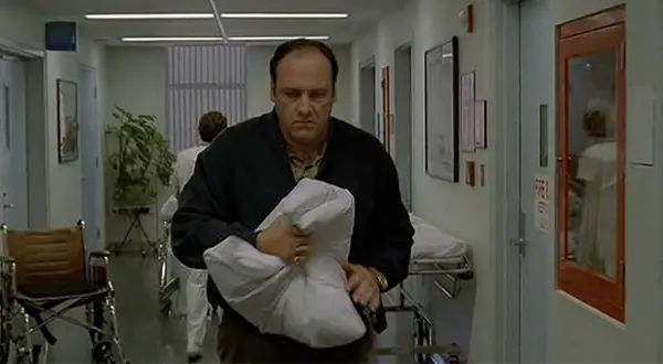 5 Things I Learned From The First Season of The Sopranos 4 Tony Soprano carrying a pillow with malicious intent.