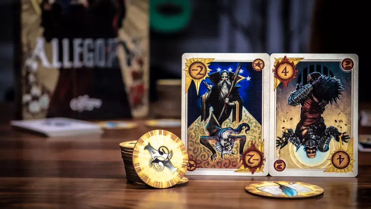 Components for Allegory including betting chips, cards, and the box in the background