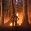broadcast series Fire Country, two characters in a forest with a fire behind them