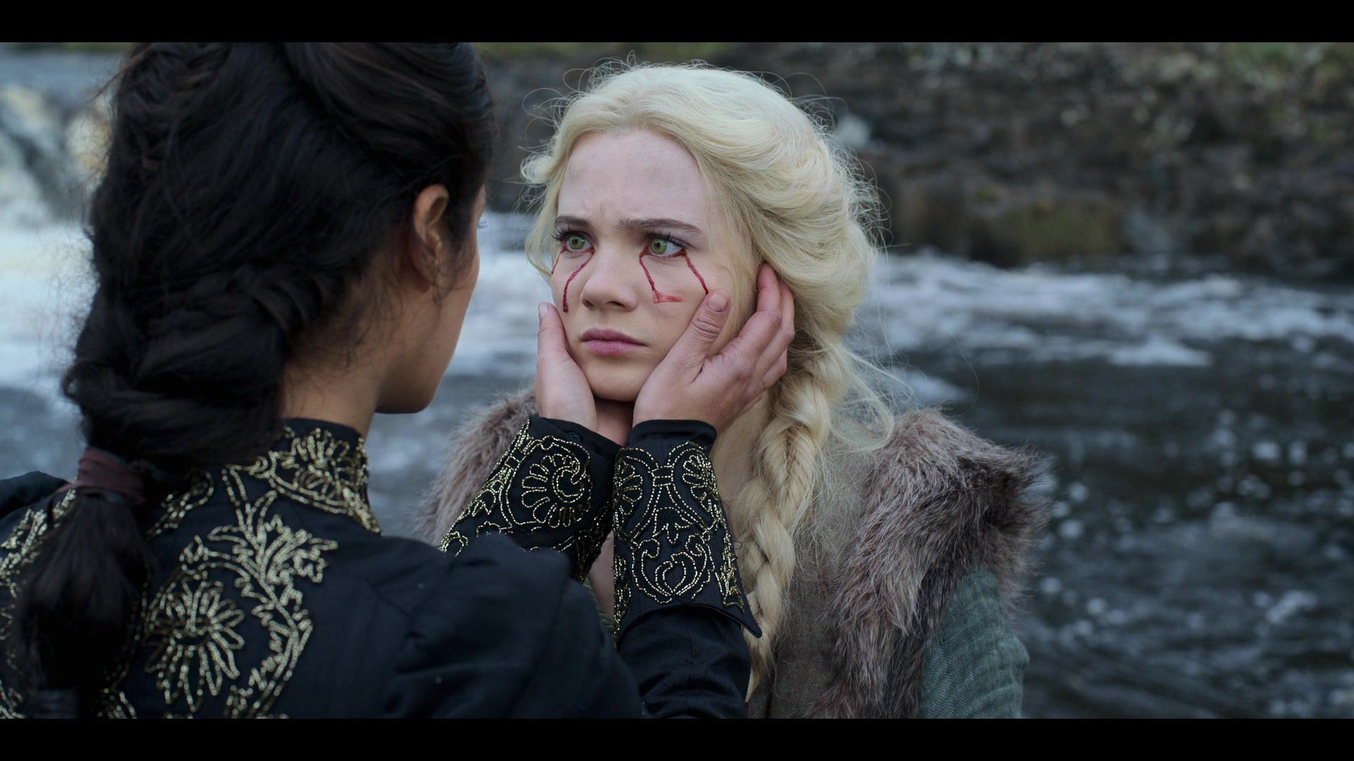 Yennefer cradles Ciri's face. 