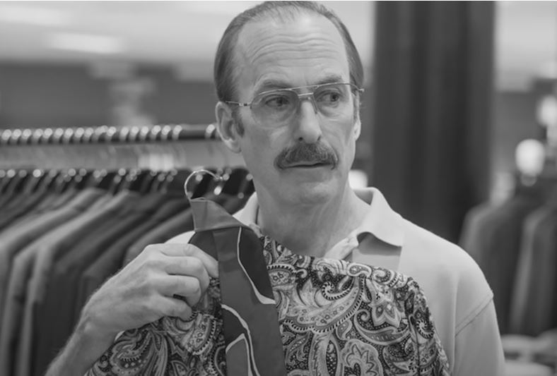 Gene checking out shirts on Better Call Saul