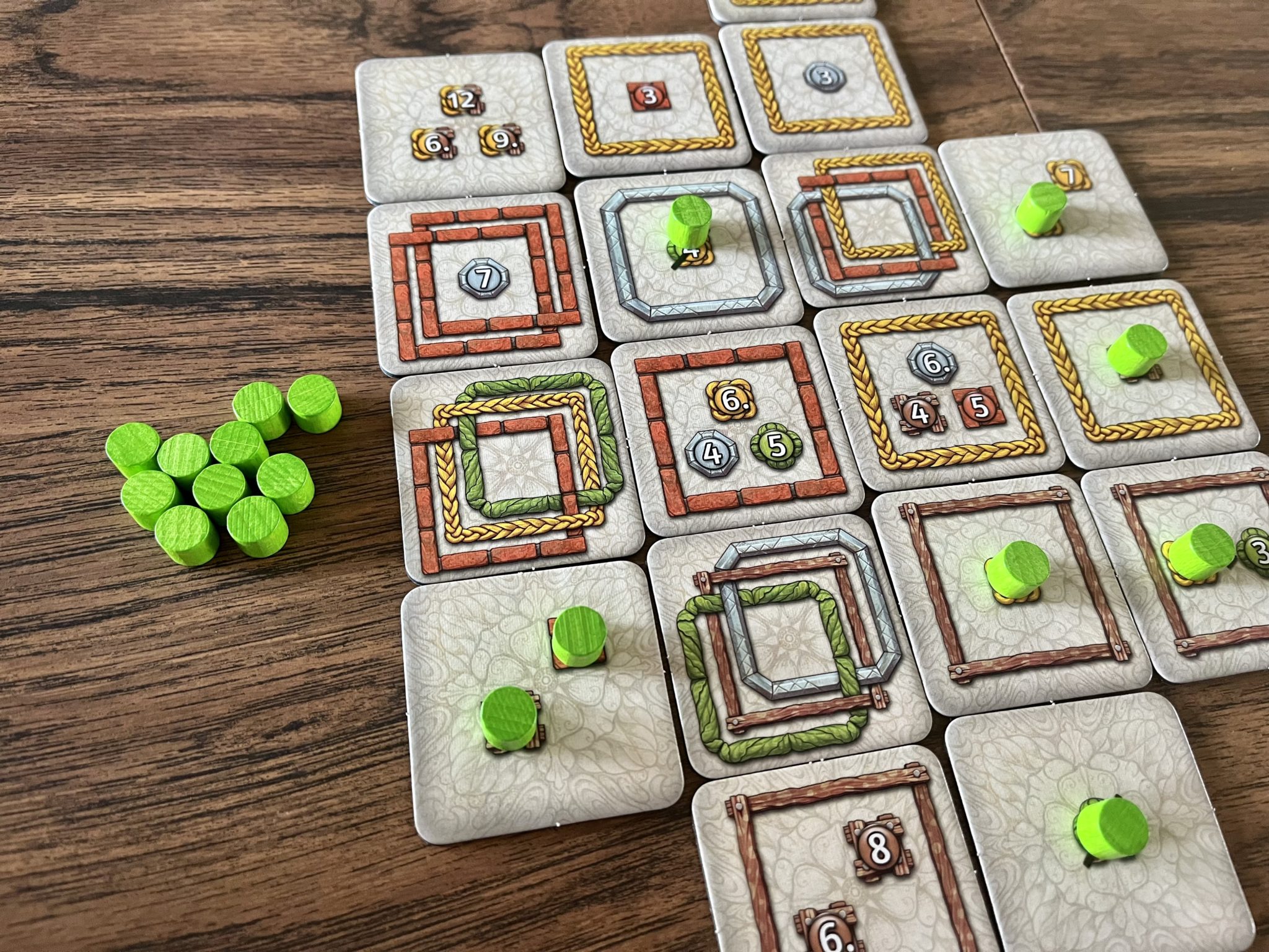 Framework green player placing down tokens on their tiles

