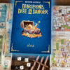 Dungeons, Dice & Danger roll and write game on the table