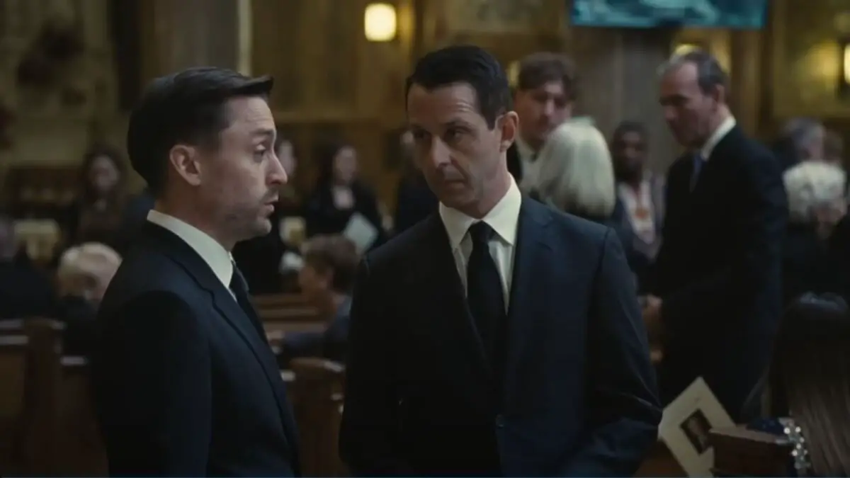 Roman and Kendall speaking at a funeral from Succession