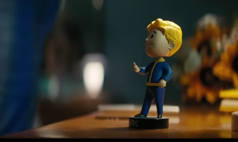 A bobblehead on a desk from Fallout
