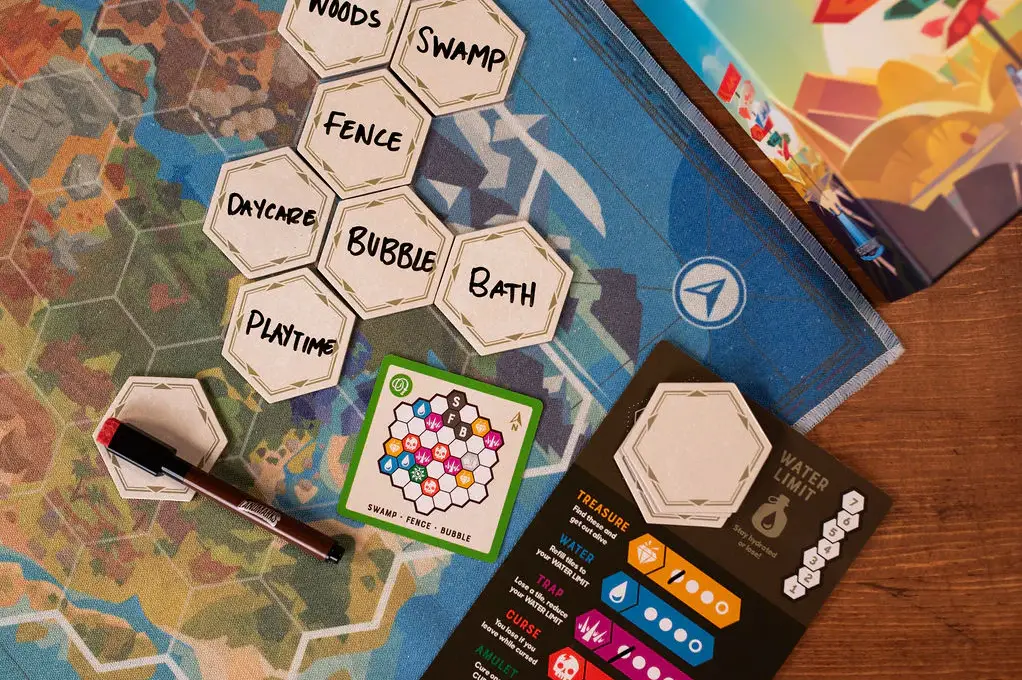 Landmarks Challenges Players to Escape the Jungle With Words 2 seven tiles with words on the landmarks map next to the map card and tracker card