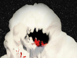 An unidentified snow monster with blood on its mouth against a black background