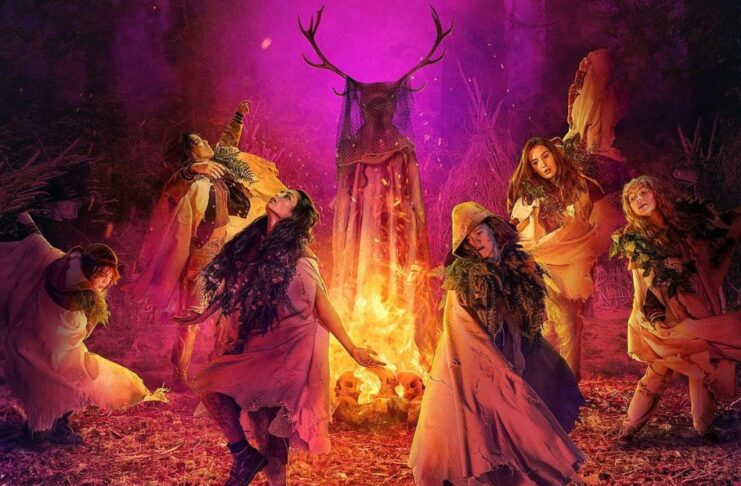 The Yellowjackets dance around the fire and their antler queen.
