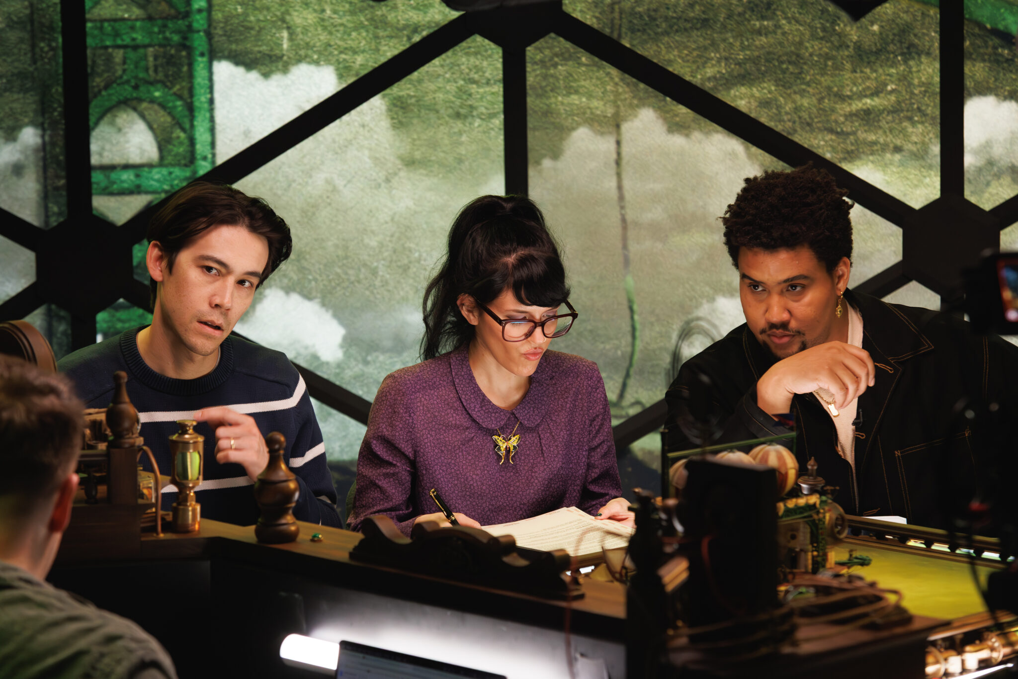 Siobhan Thompson Finally Plays The Grown Up In Dimension 20's Cloudward, Ho! 3 Cloudward Ho!' castmembers Zac (Daisuke Bucklesby), Emily (Marya Junková), and Lou (Montgomery LaMontgommery) consider their options (Credit: Kate Elliott)