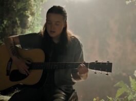 Ellie playing guitar from The Last of Us