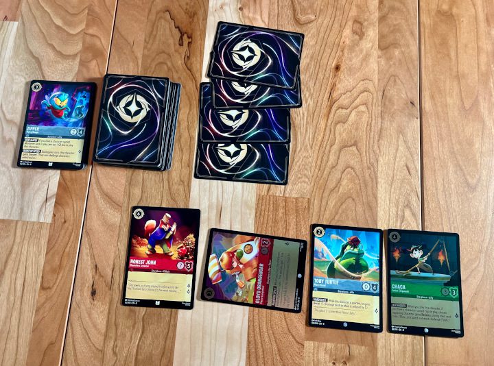 Reign Of Jafar Is About Making Your Lorcana Game Better 2 Cards being played Disney's Lorcana : Reign of Jafar