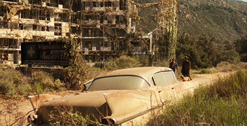 Lucy and the Ghoul outside a hospital from Fallout